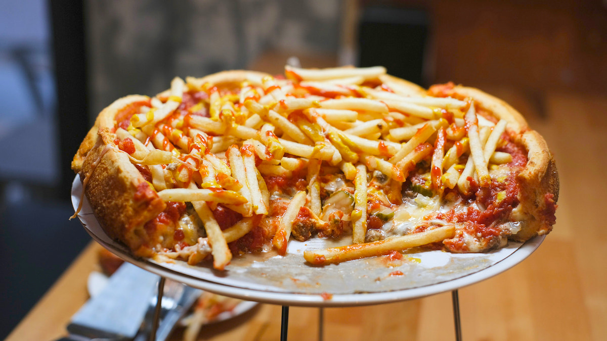 pizza with french fries on top