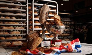 Loaves of bread and croissants being celebrated with award ribbons