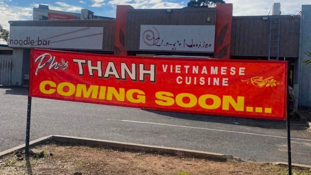 A coming soon sign for a new Vietnamese restaurant, Pho Thanh