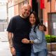 Alejandro Huerta and Galia Valadez stand arm in arm on the footpath under Barro’s neon sign