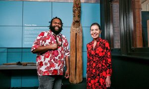 Edgell Junior Edgell and Dr Samantha Hamilton standing either side of a tall carved Vanuatu slit drum